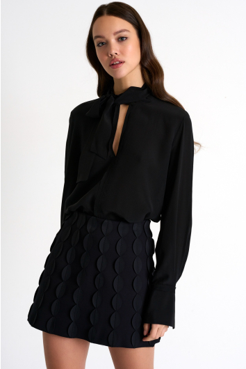 Jupe courte à détails festonnés